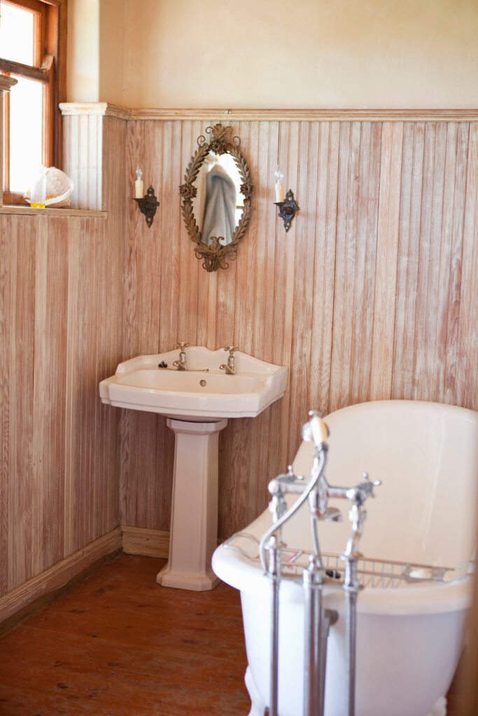 bathroom with ornate tub and mirror 2026 03 11 00 57 41 utc